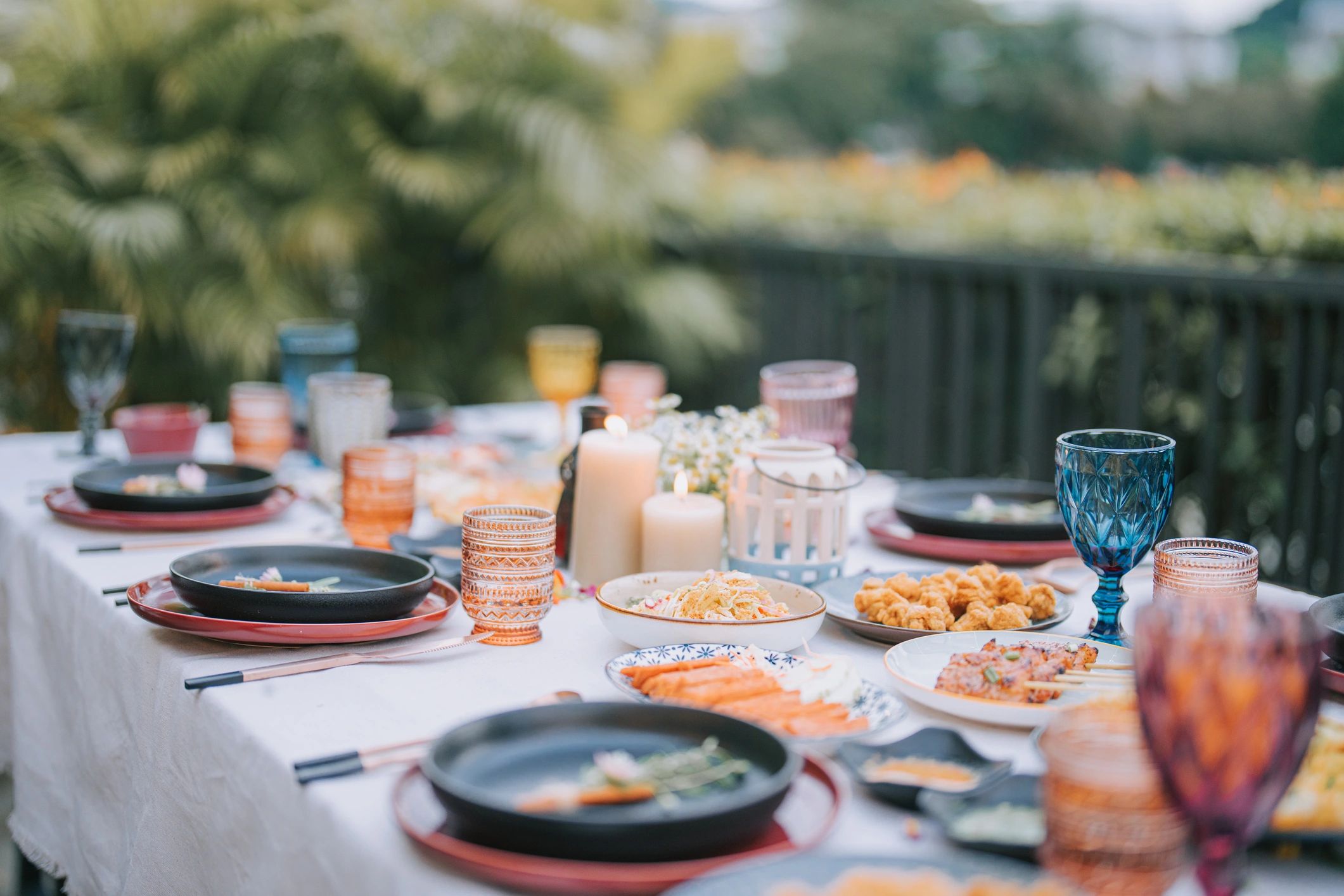Outdoor dining table set with a meal and place settings